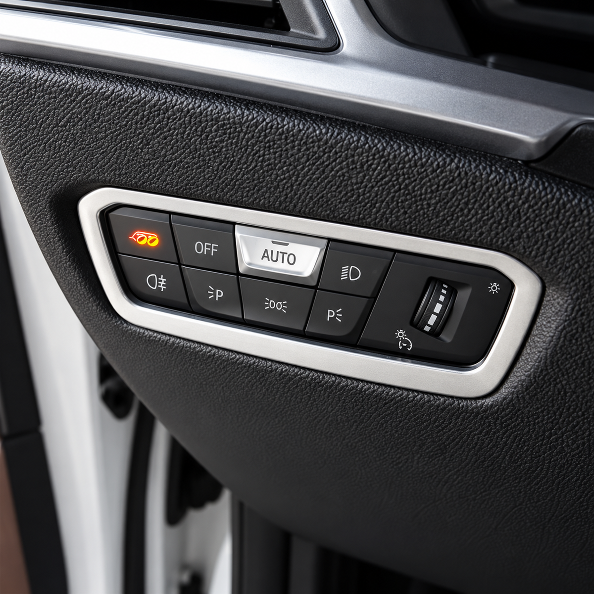 BMW G Series headlight control panel with illuminated PB Valves exhaust button