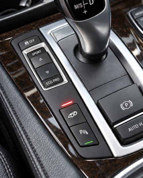 Close-up of BMW F10 integrated exhaust valve button